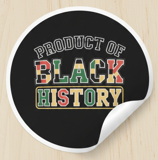 Round black mouse pad with 'Product of Black History' text on a wooden surface