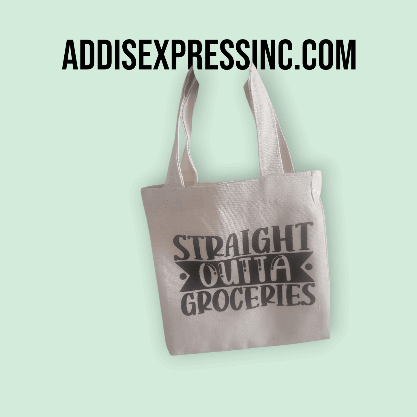 Tote bag with 'Straight Outta Groceries' text on a light green background